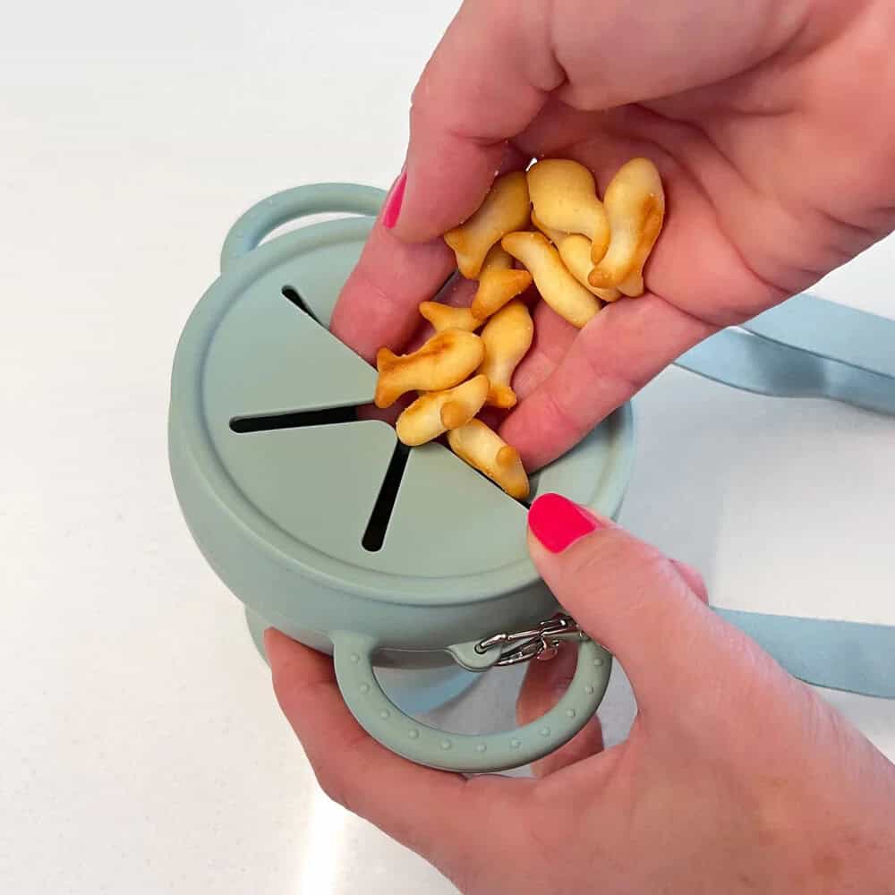 Collapsible silicone snack cup in sage with easy-clean design for toddlers.